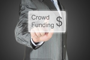 Businessman pushes virtual crowd funding button